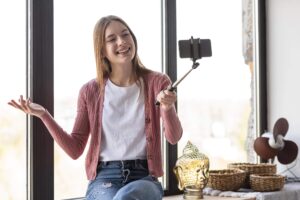 young-blogger-recording-herself-window