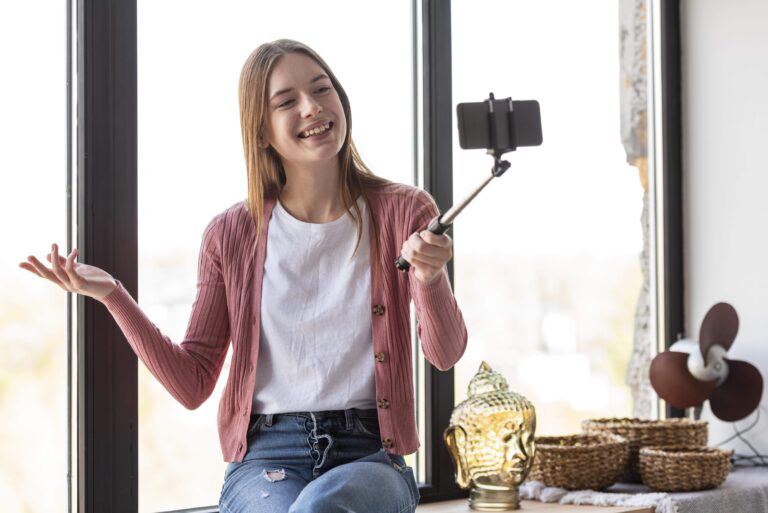 young-blogger-recording-herself-window